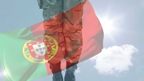 Camera tilting up, soldier holding folded US flag, lowering, saluting under waving PT flag to honor. Military, camouflage, uniform, solemn, ceremony, overlay, bluesky - Powered by Shutterstock - Get 15% off with code: PIKWIZARD15