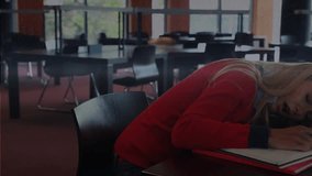 Student dozing, head settling and pen closing, bar charts growing across sweater showing study data. Notebook, library, glasses, graphs, concentration, productivity, daylight - Powered by Shutterstock - Get 15% off with code: PIKWIZARD15