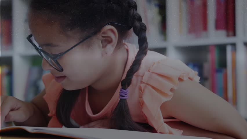 Child placing finger on open book, reading while adjusting glasses for education as HUD intensifies. Library, focus, pages, stack, spectacles, braids, youngster