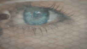 On activation HUD projecting map and readouts over blue iris while eyepiece aligning for ID scan. Holographic, overlay, biometric, futuristic, closeup, hexagon, mesh - Powered by Shutterstock - Get 15% off with code: PIKWIZARD15