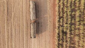 Drone aerial view supply chain carry sugar cane field eco farm net zero rural plant crop mill trailer truck road. The way forward asia Go green carbon credit neutral ESG farmer freight loading service - Powered by Shutterstock - Get 15% off with code: PIKWIZARD15