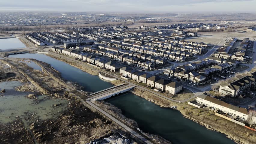Aerial view of Barrhaven suburban housing development in Ottawa during early winter morning light. g.