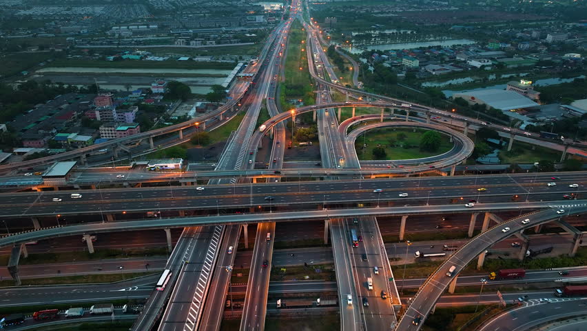 Aerial view of Bangna highway intersection, Bangkok, Thailand. Traffic on the road during evening rush hour.
