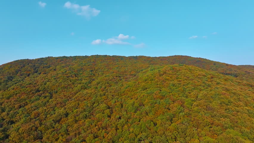 Clear Autumn Sky Over Colorful Mountain Foliage – Scenic Nature Landscape