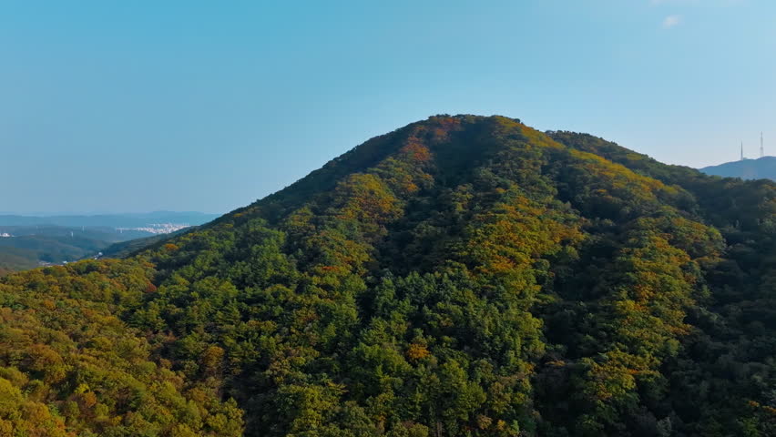 Autumn-Colored Mountain under Clear Blue Sky – Scenic Natural Landscape