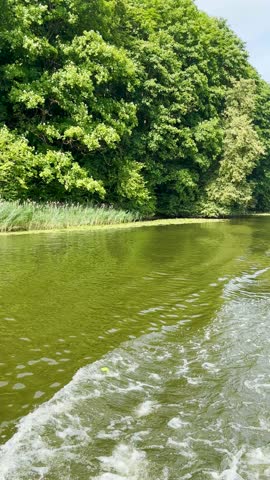 A relaxing boat trip on Ternopil Pond in Ternopil, Ukraine offers scenic views of calm waters, lush surroundings, and the charming cityscape.