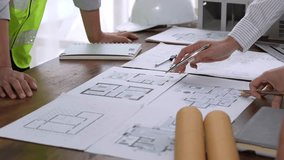 Professional architects and engineers collaborating on a new construction project in the office - Powered by Shutterstock - Get 15% off with code: PIKWIZARD15