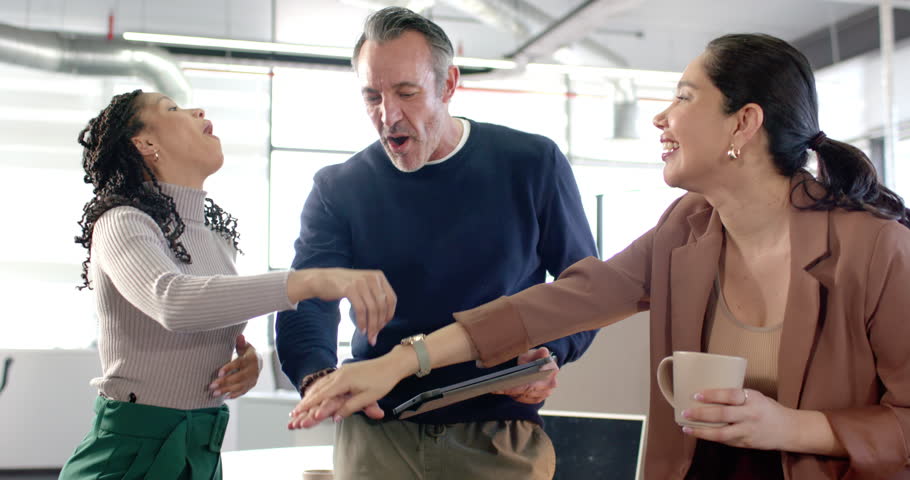 Tablet-holding man encouraging Diverse coworkers joining palms lifting arms and embracing at office. Collaboration, teamwork, celebration, diversity, camaraderie, professionalism, unity