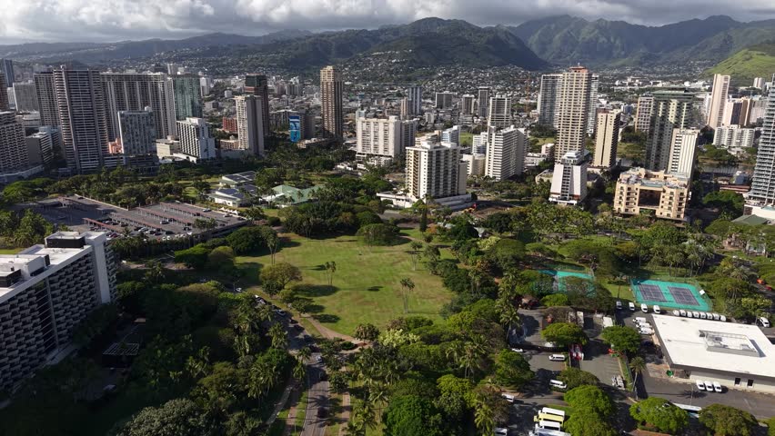 Aerial View of Honolulu Hawaii USA, Green Park, Hotels and Condominium Buildings, Drone Shot