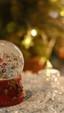 Vertical video. Christmas snow globe. Christmas background with festive cozy atmosphere. - Powered by Shutterstock - Get 15% off with code: PIKWIZARD15
