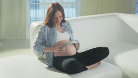 Pregnancy motherhood. Pregnant woman holding headphones near belly listening music for mother and unborn baby. Girl enjoying pregnancy listen music for relax calm wellness. Prenatal music stimulation - Powered by Shutterstock - Get 15% off with code: PIKWIZARD15