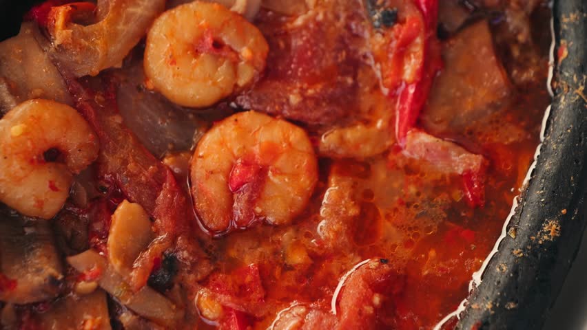 Stewed shrimp with sweet and sour sauce with tomatoes and peppers. High quality 4k footage