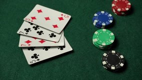 A player prepares to collect his winnings, showing a two-pair hand. A stack of colorful poker chips is stacked nearby, creating a lively atmosphere. - Powered by Shutterstock - Get 15% off with code: PIKWIZARD15