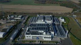 cutting edge technology and futuristic Ai infrastructure of a large-scale data center campus in Germany processing global information. Great aerial view flight circle drone footage - Powered by Shutterstock - Get 15% off with code: PIKWIZARD15