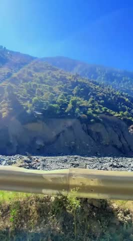 Beautiful sunrise view over mountain landscape from a moving car