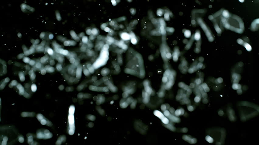 Super Slow Motion Shot of Breaking Real Glass at 1000 fps . Isolated on Black Background