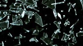 Super Slow Motion Shot of Breaking Real Glass at 1000 fps . Isolated on Black Background - Powered by Shutterstock - Get 15% off with code: PIKWIZARD15