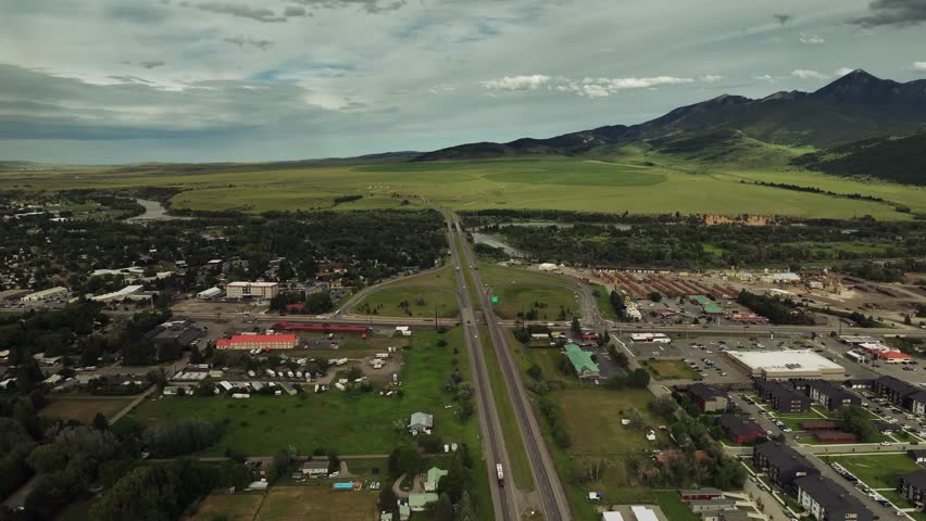 Aerial drone view of mountains, fields, and rural landscape in Montana, USA