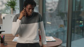 African American business man businessman male guy communicate with smartphone mobile phone call on background of diversity managers coming in office with laptop three multiracial people in company - Powered by Shutterstock - Get 15% off with code: PIKWIZARD15