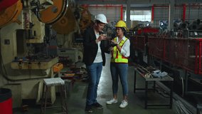 Caucasian male manager and an Asian female engineer collaborating over a digital tablet inside factory. teamwork, modern technology, and cross-cultural technical consultation in industrial management. - Powered by Shutterstock - Get 15% off with code: PIKWIZARD15