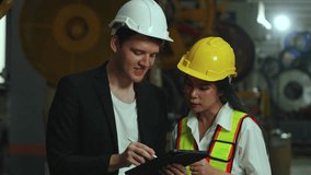 Caucasian male manager and an Asian female engineer collaborating over a digital tablet inside factory. teamwork, modern technology, and cross-cultural technical consultation in industrial management. - Powered by Shutterstock - Get 15% off with code: PIKWIZARD15