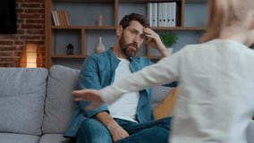 Stressed tired Caucasian father close ears noisy daughter running family at home. Naughty girl active run playing dad feel stress headache with hyperactive kid child difficult parenting bad behavior - Powered by Shutterstock - Get 15% off with code: PIKWIZARD15
