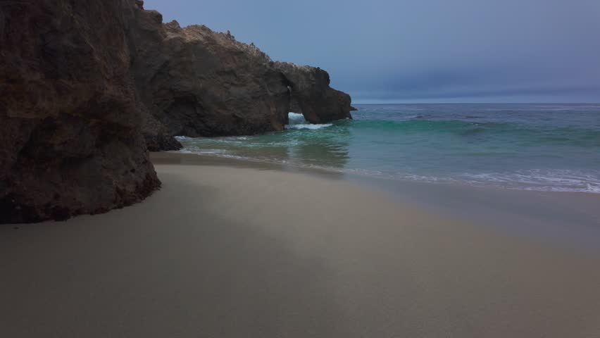 Garrapata Beach Big Sur California USA video footage of powerful Pacific Ocean waves crashing onto sandy shore with dramatic surf and coastal scenery