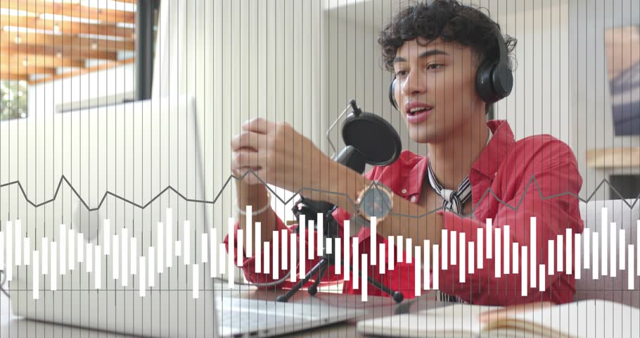 Man at desk starting podcast, speaking into mic and activating audio waveform while gesturing. Creator, host, broadcaster, studio, microphone, headphones, laptop