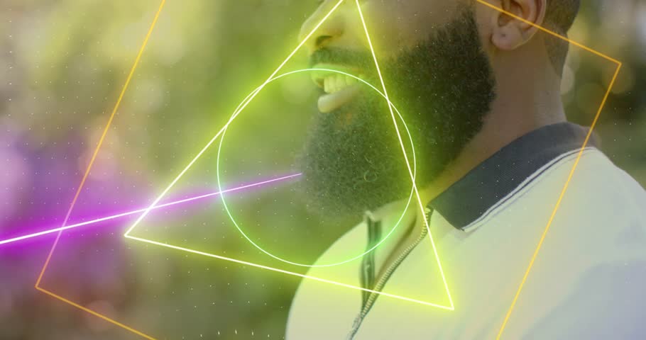 Mid-adult man responding to neon overlays animating over face, smiling, singing for music promotion. Outdoor, garden, foliage, sunlit, bokeh, geometric, portrait