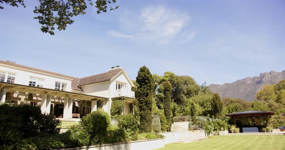 Frame four bright nodes appearing and linking over two-story house and lawn, mapping garden network. Estate, overlay, architecture, topiary, hedges, gazebo, pergola