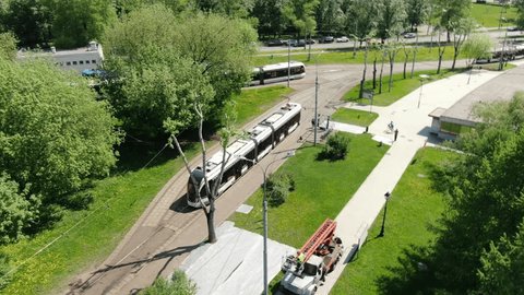 Aerial Forward Shot over Trams Green Urban