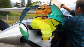 Man lifting engine cowl, reaching into twin engine on apron, doing preflight, globe overlaying. Aircraft, propeller, technician, maintenance, inspection, airfield, ramp - Powered by Shutterstock - Get 15% off with code: PIKWIZARD15