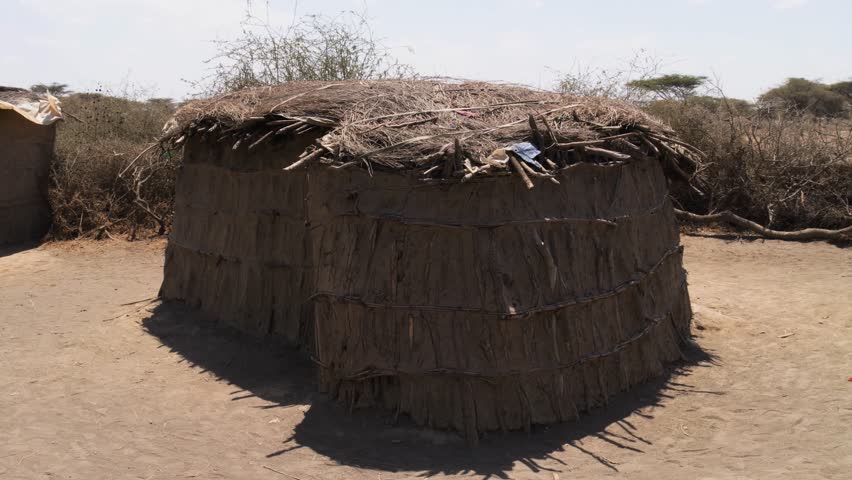 Traditional Maasai hut built with mud, sticks and thatched roof