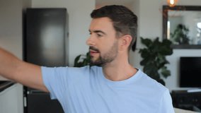 Proud handsome man playing with a necklace with the rainbow colours  - Powered by Shutterstock - Get 15% off with code: PIKWIZARD15