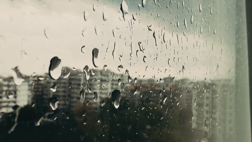 Rain Drops Behind the Window Glass View