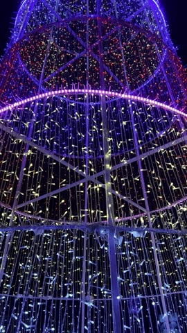 Tall Christmas tree structure with colorful lights