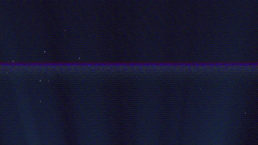 Signal glitch causing grainy navy field shifting scan lines and specks fading, showing artifacts. Distortion, static, banding, speckle, grain, blue, monitor