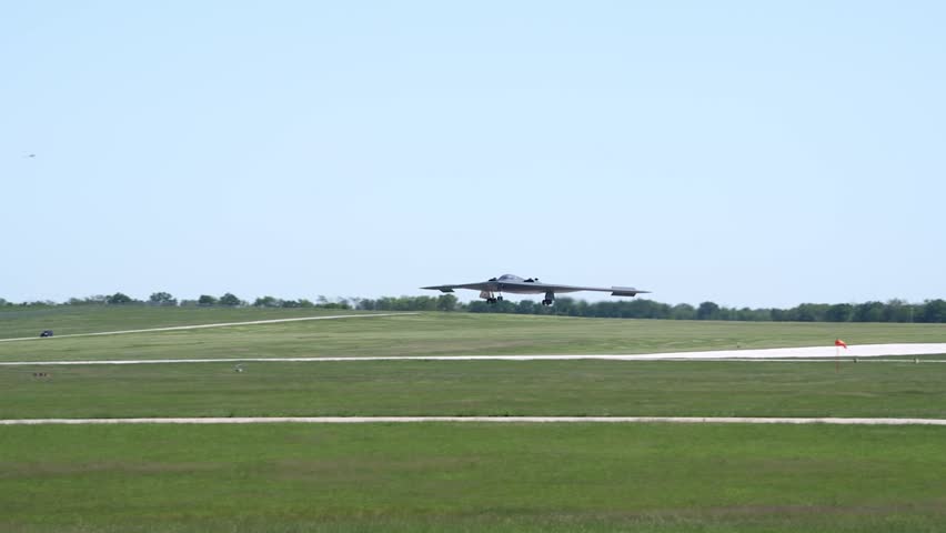 The B-2 Spirit is designed with special composite materials and a flying wing design to reduce detection by radar, infrared, and sound, making it very difficult to track.