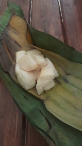 Cassava tape video is a traditional Indonesian food made from the fermentation process of cassava using yeast converted into sugar and alcohol, a slightly sweet and sour taste and a softer texture.