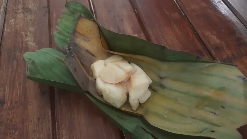 Cassava tape is a traditional Indonesian food made from the fermentation process of cassava using yeast converted into sugar and alcohol, a slightly sweet and sour taste and a softer texture.