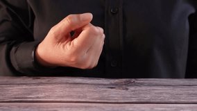 Bank messages. Close-up of a woman's hand at a table holding a virtual icon of a mailing envelope with a bank logo. - Powered by Shutterstock - Get 15% off with code: PIKWIZARD15
