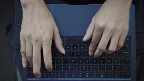 Top-Down Cinematic Shot of a Person Typing on a Laptop. A cinematic top-down shot of a person typing on a laptop at a clean, minimalist workspace. - Powered by Shutterstock - Get 15% off with code: PIKWIZARD15