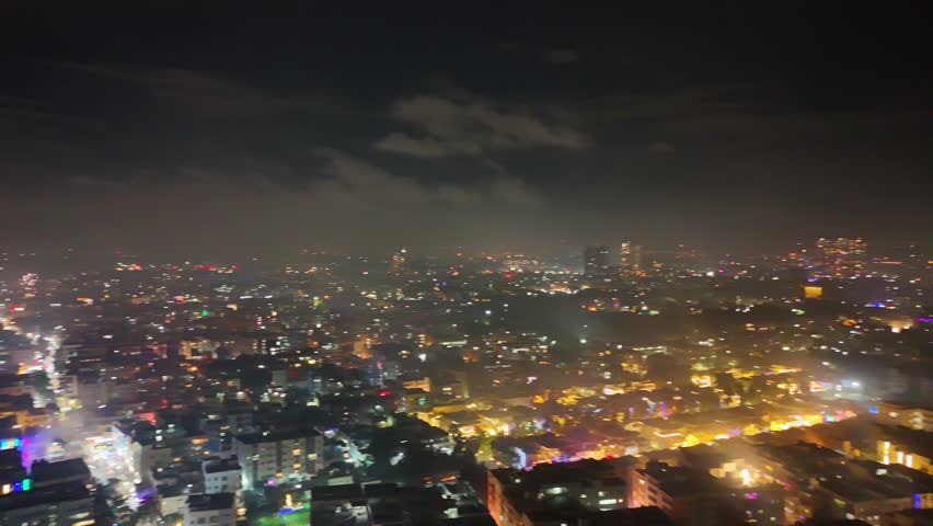 4K Aerial Night View of Bustling Metropolitan City – Urban Lights, Busy Roads, High-Rise Buildings, Nightlife Atmosphere, and Vibrant Tier-1 Suburban Development