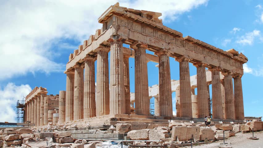 Architectural masterpiece, the Parthenon, a unique UNESCO world heritage archaeological site of Acropolis hill with  clouds and deep blue sky, Athens historic center, Attica, Greece