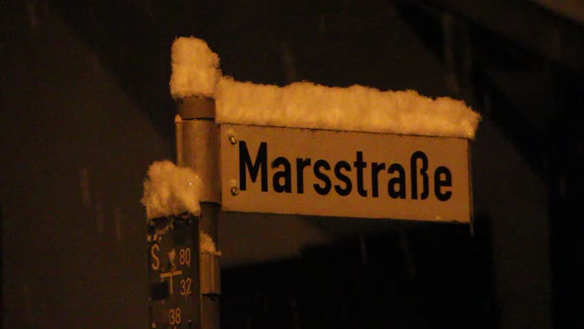 Heavy snowfall on a street, street sign in the snow, Moosburg an der Isar, Germany, Bavaria, 1 December 2023, Close-up, without sound