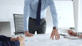 Business people team analyzing financial charts and graphs during strategy meeting in modern office, focusing on corporate planning, and decision making - Powered by Shutterstock - Get 15% off with code: PIKWIZARD15