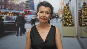 Senior woman with grey hair stands on an urban street decorated for the holidays, surrounded by blurred cityscape and christmas trees, embodying a festive, metropolitan vibe. - Powered by Shutterstock - Get 15% off with code: PIKWIZARD15