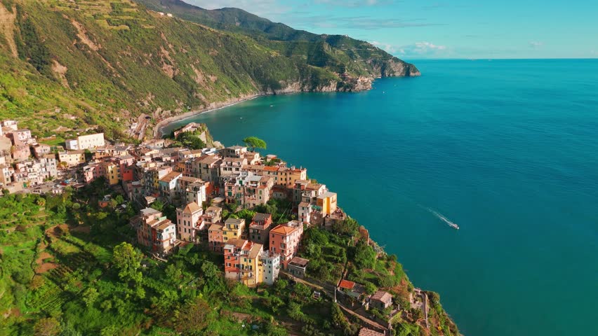Aerial view of the Corniglia town in the famous Cinque Terre, Italian Riviera, Liguria, Italy. Stunning historic village with colorful buildings nestled between cliffs and the Ligurian Sea. 