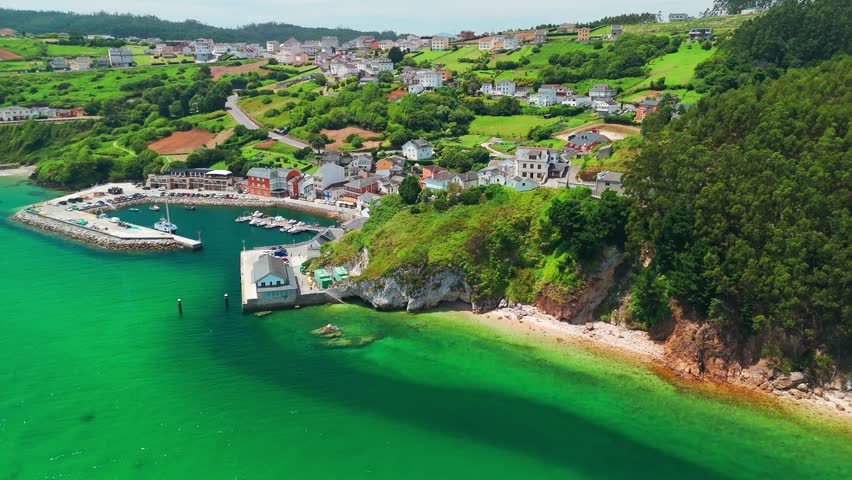 Aerial view of O Porto do Barqueiro, a picturesque fishing village and port in Manon, Ferrolterra, province of A Coruna, Galicia, Spain. Traditional coastal parish with maritime heritage.