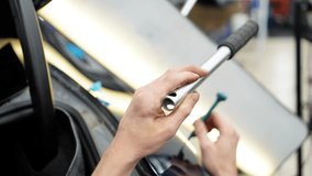  A specialist repairs a dent on the car body without painting. PDR. Process of paintless dent repair on car body. The mechanic at the auto shop with tools to repair dents in car body. Body car repair. - Powered by Shutterstock - Get 15% off with code: PIKWIZARD15